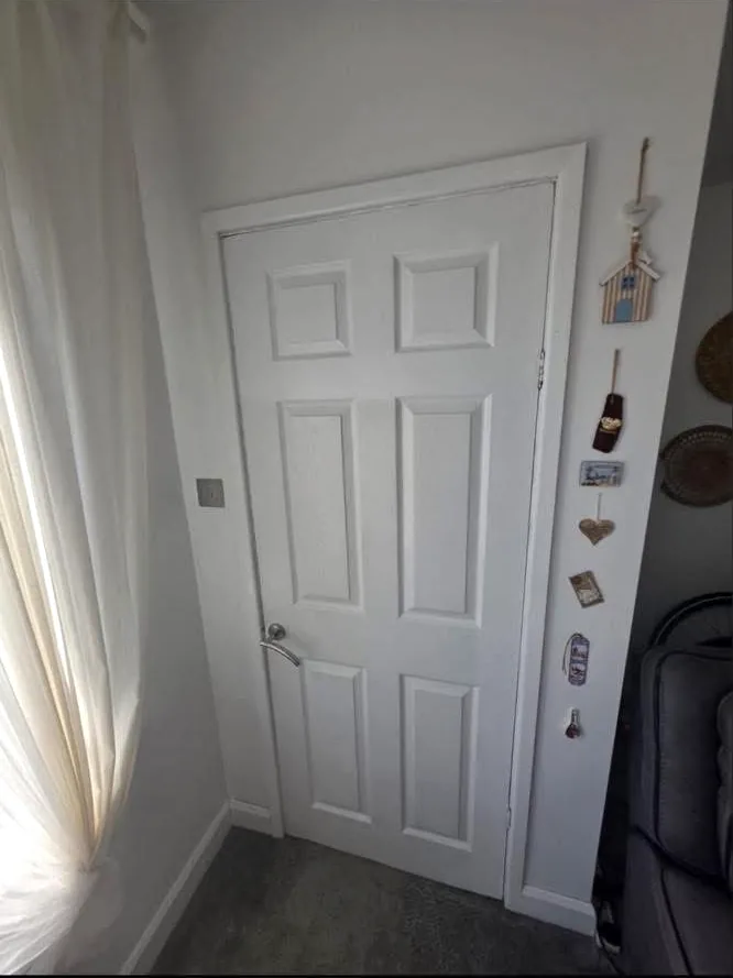 White panelled internal door before replacement