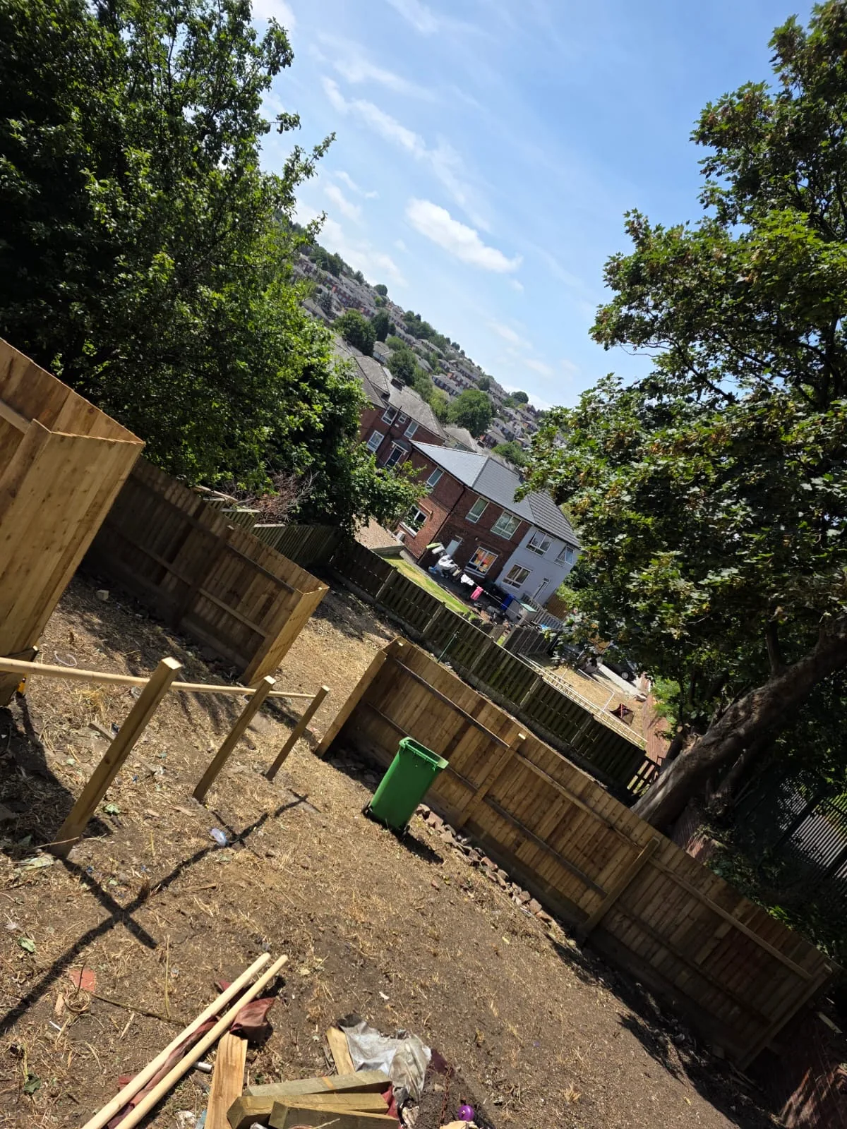 Garden boundary fencing installation in progress