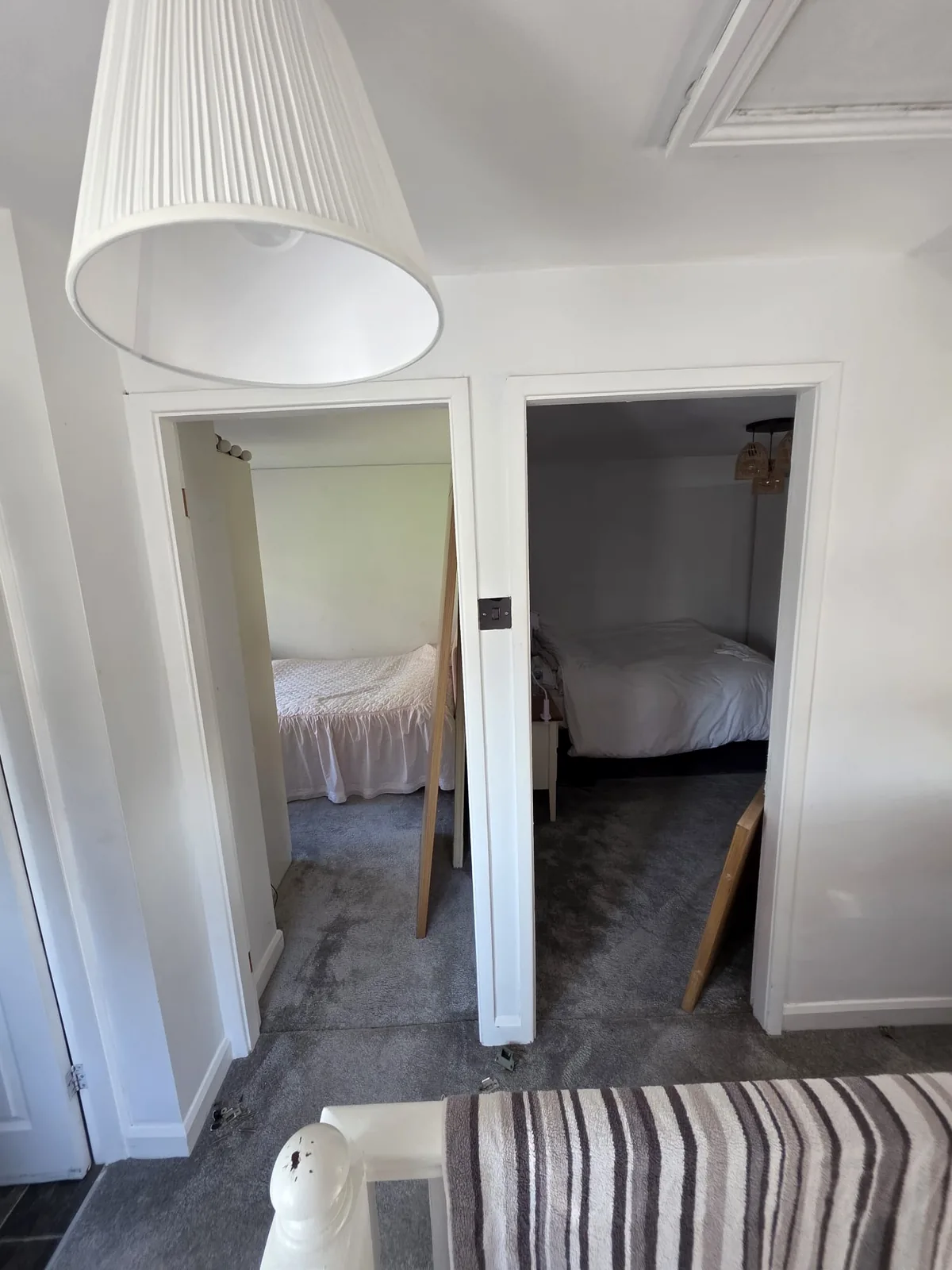 Two open bedroom doorways on the landing before new doors were fitted