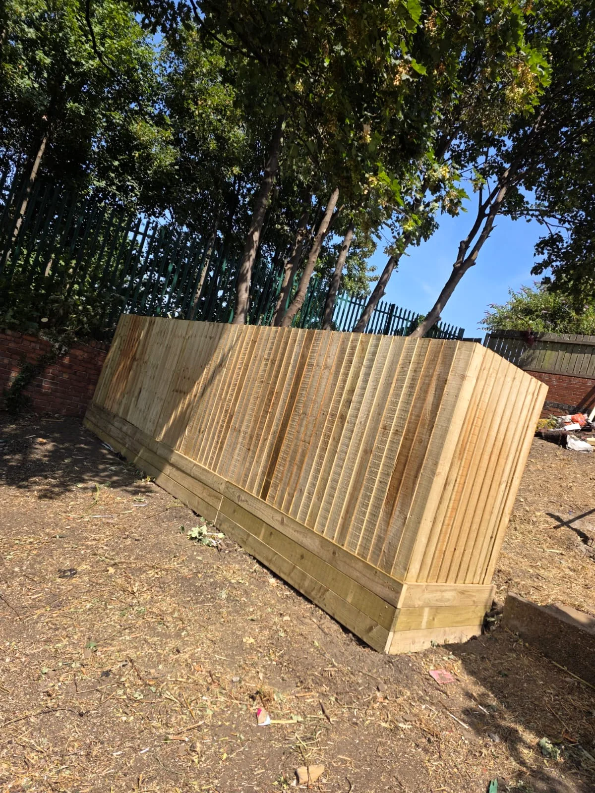 Completed timber fencing enclosing part of the garden