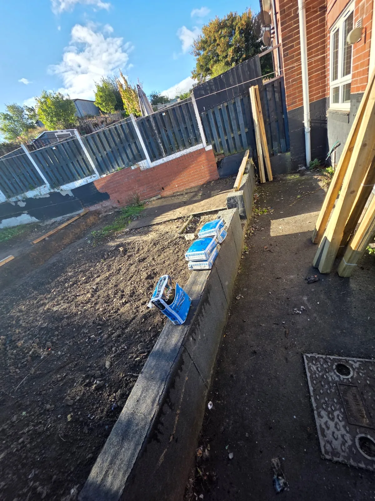 Terraced garden prepared for new timber fencing